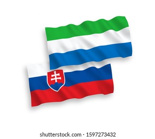 National vector fabric wave flags of Slovakia and Sierra Leone isolated on white background. 1 to 2 proportion.