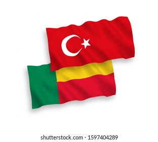 National vector fabric wave flags of Turkey and Benin isolated on white background. 1 to 2 proportion.