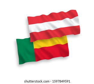 National vector fabric wave flags of Austria and Benin isolated on white background. 1 to 2 proportion.