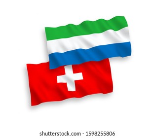 National vector fabric wave flags of Sierra Leone and Switzerland isolated on white background. 1 to 2 proportion.