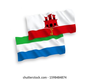 National vector fabric wave flags of Sierra Leone and Gibraltar isolated on white background. 1 to 2 proportion.