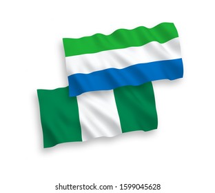 National vector fabric wave flags of Sierra Leone and Nigeria isolated on white background. 1 to 2 proportion.