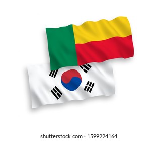 National vector fabric wave flags of South Korea and Benin isolated on white background. 1 to 2 proportion.