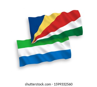 National vector fabric wave flags of Sierra Leone and Seychelles isolated on white background. 1 to 2 proportion.