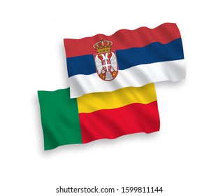 National vector fabric wave flags of Benin and Serbia isolated on white background. 1 to 2 proportion.