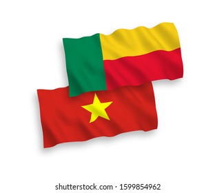 National vector fabric wave flags of Benin and Vietnam isolated on white background. 1 to 2 proportion.