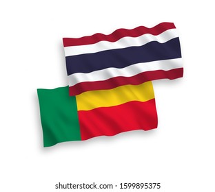 National vector fabric wave flags of Benin and Thailand isolated on white background. 1 to 2 proportion.