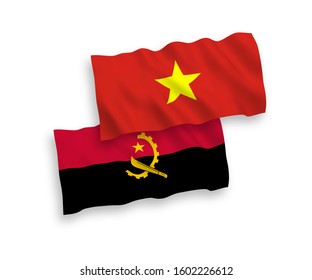 National vector fabric wave flags of Angola and Vietnam isolated on white background. 1 to 2 proportion.