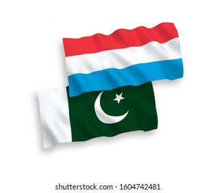 National vector fabric wave flags of Pakistan and Luxembourg isolated on white background. 1 to 2 proportion.