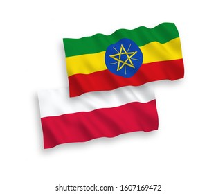 National vector fabric wave flags of Ethiopia and Poland isolated on white background. 1 to 2 proportion.