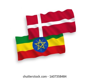 National vector fabric wave flags of Denmark and Ethiopia isolated on white background. 1 to 2 proportion.