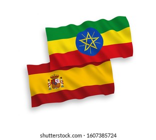 National vector fabric wave flags of Ethiopia and Spain isolated on white background. 1 to 2 proportion.