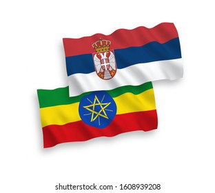 National vector fabric wave flags of Ethiopia and Serbia isolated on white background. 1 to 2 proportion.