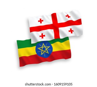 National vector fabric wave flags of Ethiopia and Georgia isolated on white background. 1 to 2 proportion.