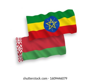 National vector fabric wave flags of Ethiopia and Belarus isolated on white background. 1 to 2 proportion.
