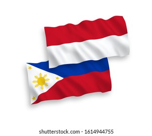 National vector fabric wave flags of Indonesia and Philippines isolated on white background. 1 to 2 proportion.