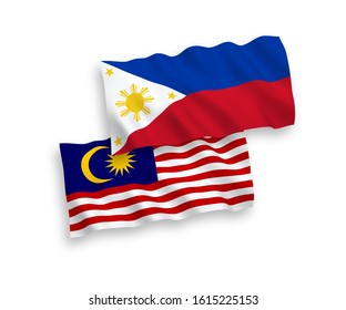 National vector fabric wave flags of Philippines and Malaysia isolated on white background. 1 to 2 proportion.
