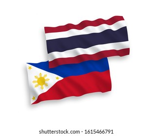 National vector fabric wave flags of Philippines and Thailand isolated on white background. 1 to 2 proportion.