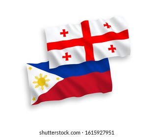 National vector fabric wave flags of Philippines and Georgia isolated on white background. 1 to 2 proportion.