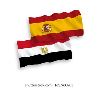 National vector fabric wave flags of Egypt and Spain isolated on white background. 1 to 2 proportion.