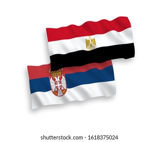 National vector fabric wave flags of Egypt and Serbia isolated on white background. 1 to 2 proportion.