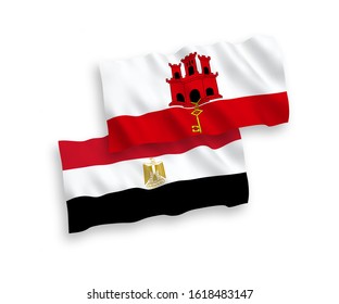 National vector fabric wave flags of Egypt and Gibraltar isolated on white background. 1 to 2 proportion.