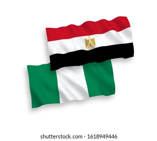 National vector fabric wave flags of Egypt and Nigeria isolated on white background. 1 to 2 proportion.