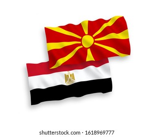 National vector fabric wave flags of Egypt and North Macedonia isolated on white background. 1 to 2 proportion.