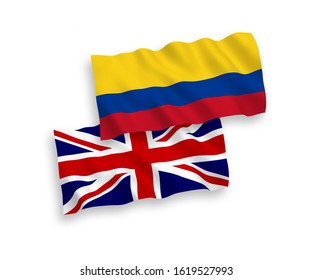 National vector fabric wave flags of Great Britain and Colombia isolated on white background. 1 to 2 proportion.