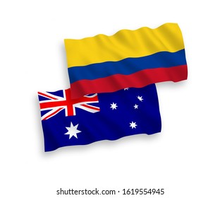 National vector fabric wave flags of Australia and Colombia isolated on white background. 1 to 2 proportion.
