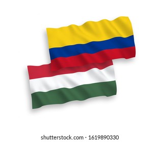 National vector fabric wave flags of Colombia and Hungary isolated on white background. 1 to 2 proportion.