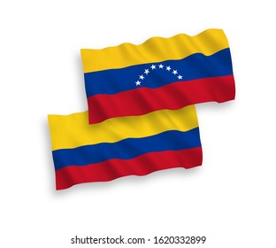 National vector fabric wave flags of Venezuela and Colombia isolated on white background. 1 to 2 proportion.