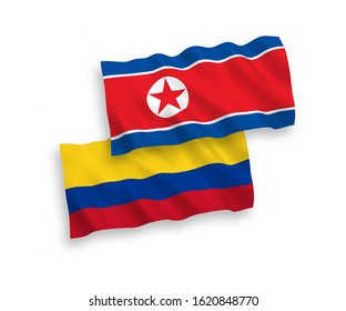 National vector fabric wave flags of North Korea and Colombia isolated on white background. 1 to 2 proportion.