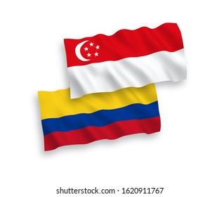 National vector fabric wave flags of Colombia and Singapore isolated on white background. 1 to 2 proportion.