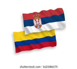 National vector fabric wave flags of Colombia and Serbia isolated on white background. 1 to 2 proportion.