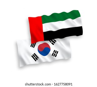 National vector fabric wave flags of South Korea and United Arab Emirates isolated on white background. 1 to 2 proportion.