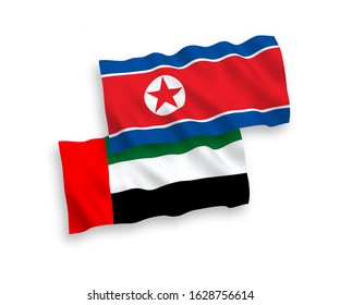 National vector fabric wave flags of North Korea and United Arab Emirates isolated on white background. 1 to 2 proportion.