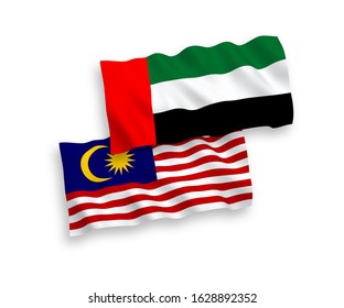 National vector fabric wave flags of United Arab Emirates and Malaysia isolated on white background. 1 to 2 proportion.