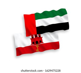 National vector fabric wave flags of United Arab Emirates and Gibraltar isolated on white background. 1 to 2 proportion.