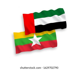 National vector fabric wave flags of United Arab Emirates and Myanmar isolated on white background. 1 to 2 proportion.