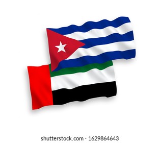 National vector fabric wave flags of United Arab Emirates and Cuba isolated on white background. 1 to 2 proportion.
