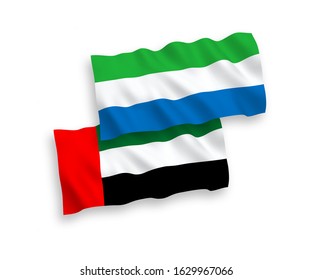 National vector fabric wave flags of United Arab Emirates and Sierra Leone isolated on white background. 1 to 2 proportion.