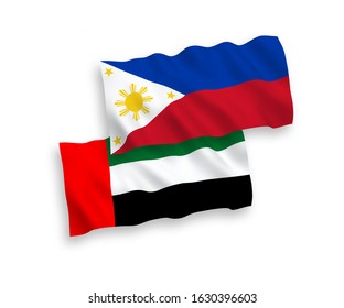 National vector fabric wave flags of United Arab Emirates and Philippines isolated on white background. 1 to 2 proportion.