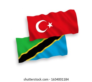 National vector fabric wave flags of Turkey and Tanzania isolated on white background. 1 to 2 proportion.