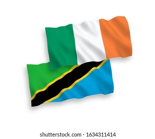 National vector fabric wave flags of Ireland and Tanzania isolated on white background. 1 to 2 proportion.