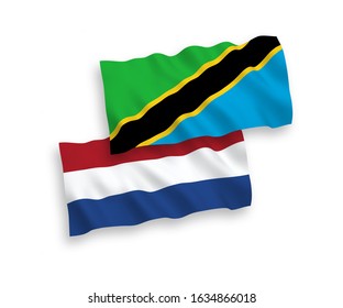National vector fabric wave flags of Tanzania and Netherlands isolated on white background. 1 to 2 proportion.