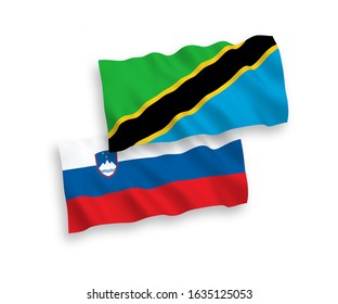 National vector fabric wave flags of Slovenia and Tanzania isolated on white background. 1 to 2 proportion.