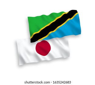 National vector fabric wave flags of Japan and Tanzania isolated on white background. 1 to 2 proportion.