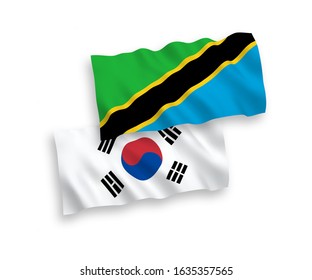 National vector fabric wave flags of South Korea and Tanzania isolated on white background. 1 to 2 proportion.