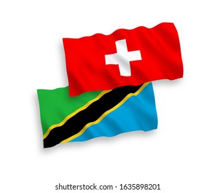 National vector fabric wave flags of Tanzania and Switzerland isolated on white background. 1 to 2 proportion.